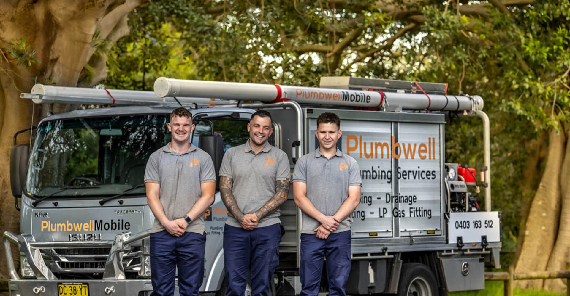 Three licensed local plumbers with their service truck